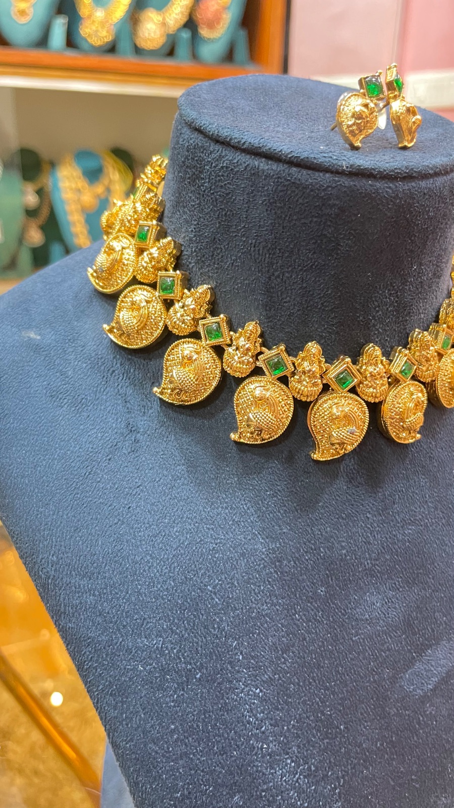 Small mango design necklace angle 2