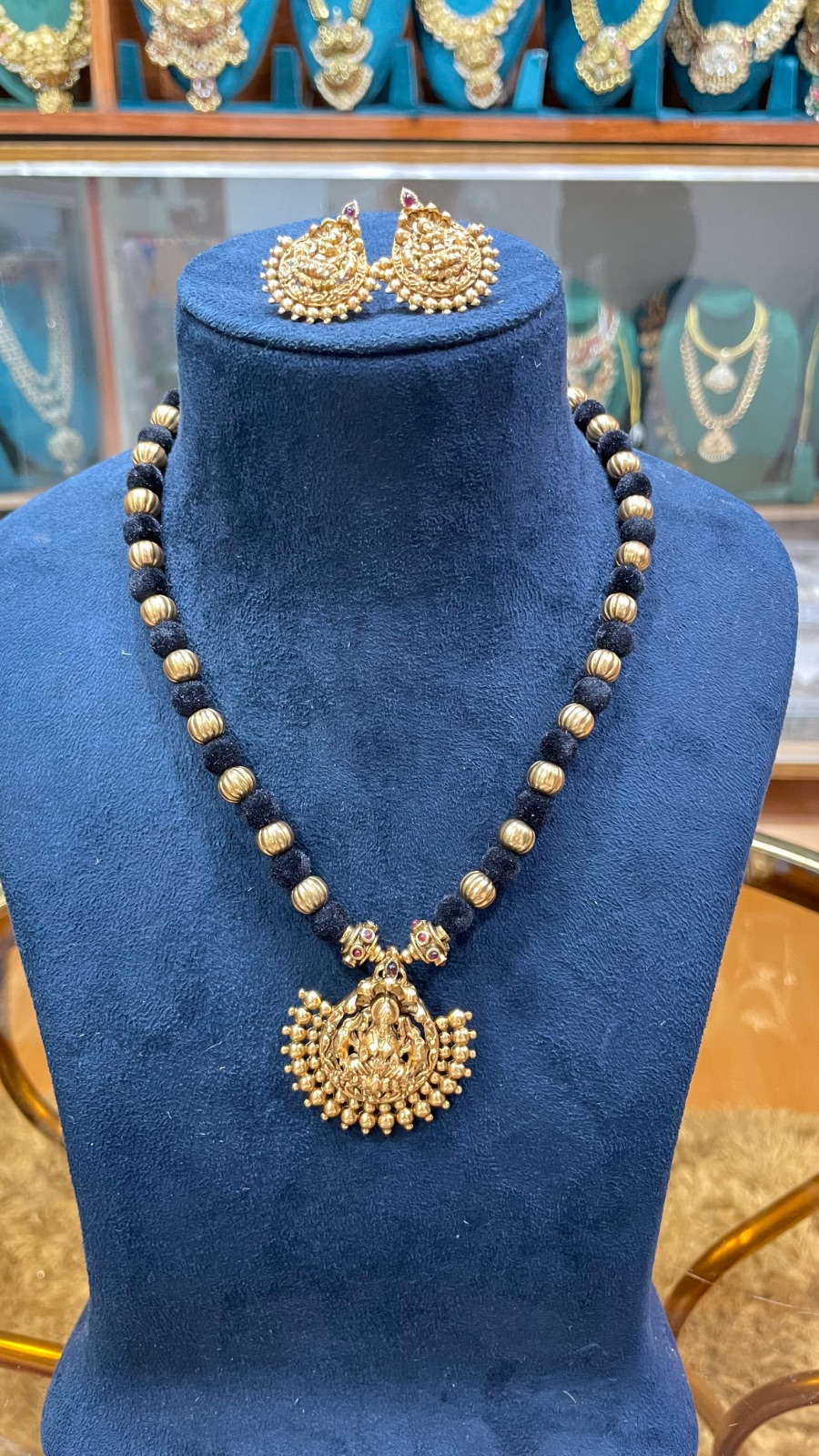 black tread with Lakshmi pendant