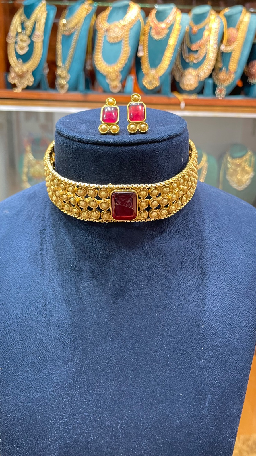 gold chain with red big stone choker