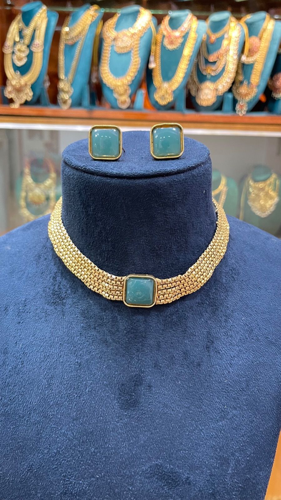 golden lays with green stones