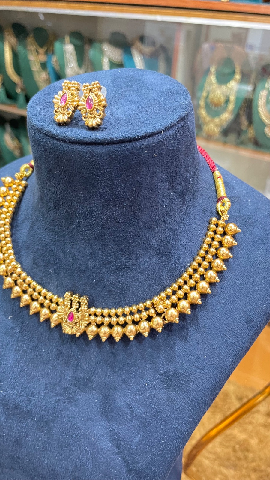 Golden Gundu design necklace angle 2