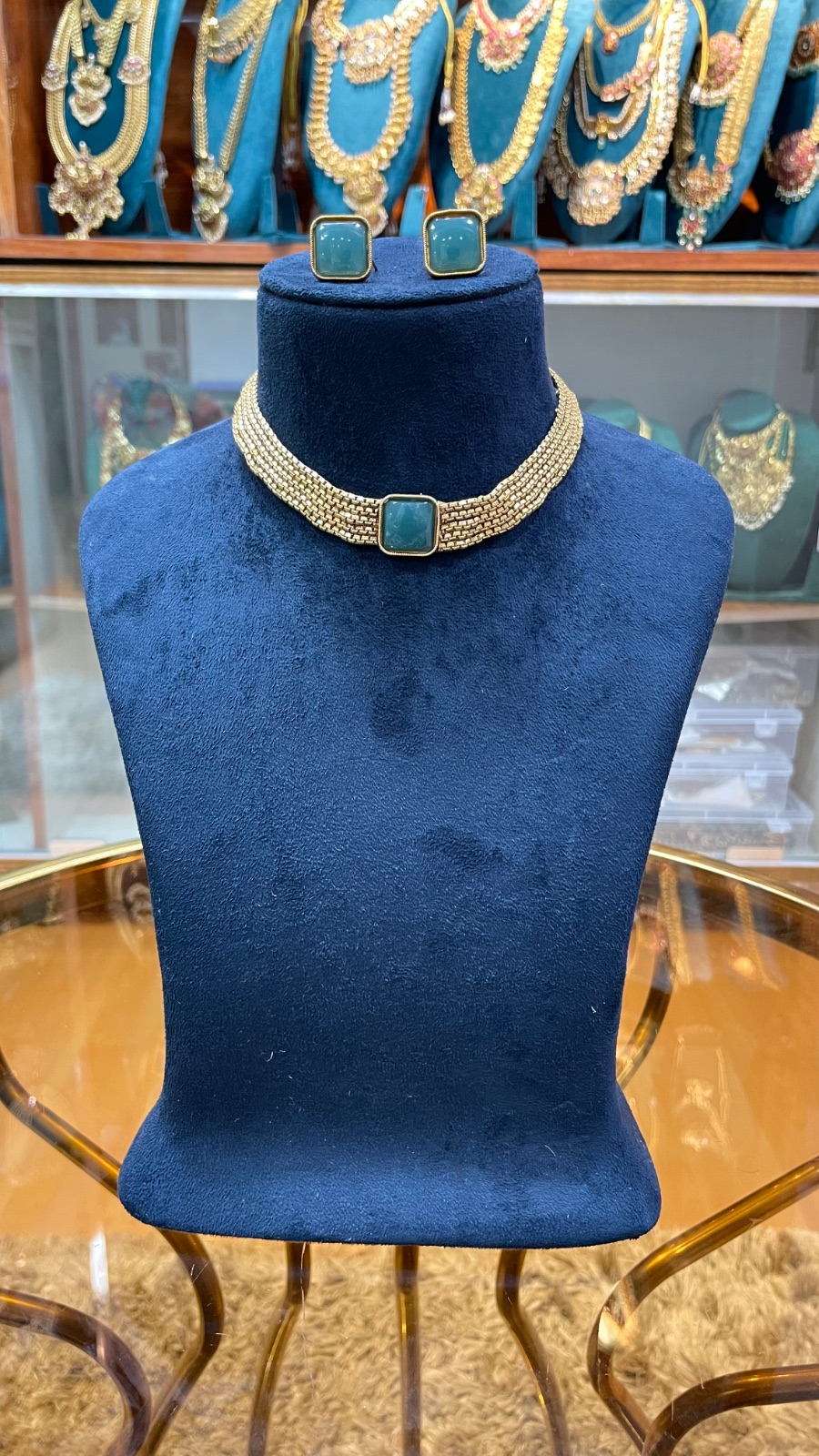 golden lays with green stones angle 2