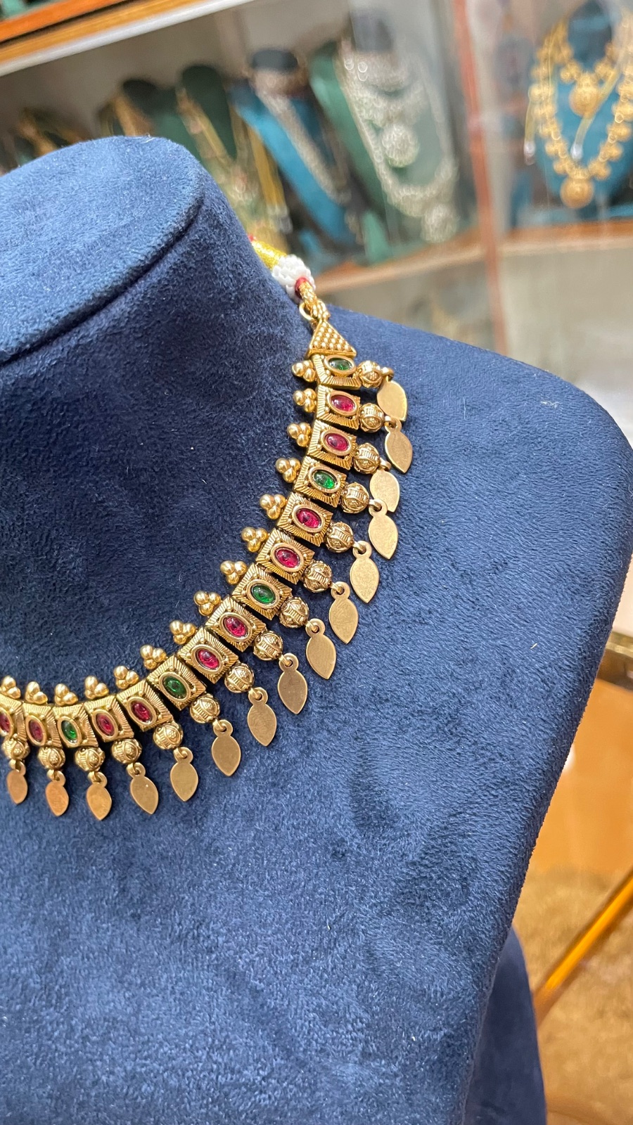 Green and red stones with leaf drops angle 3