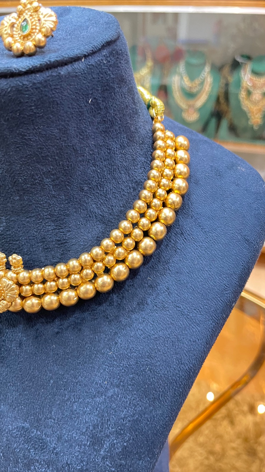 golden beads green stones angle 3