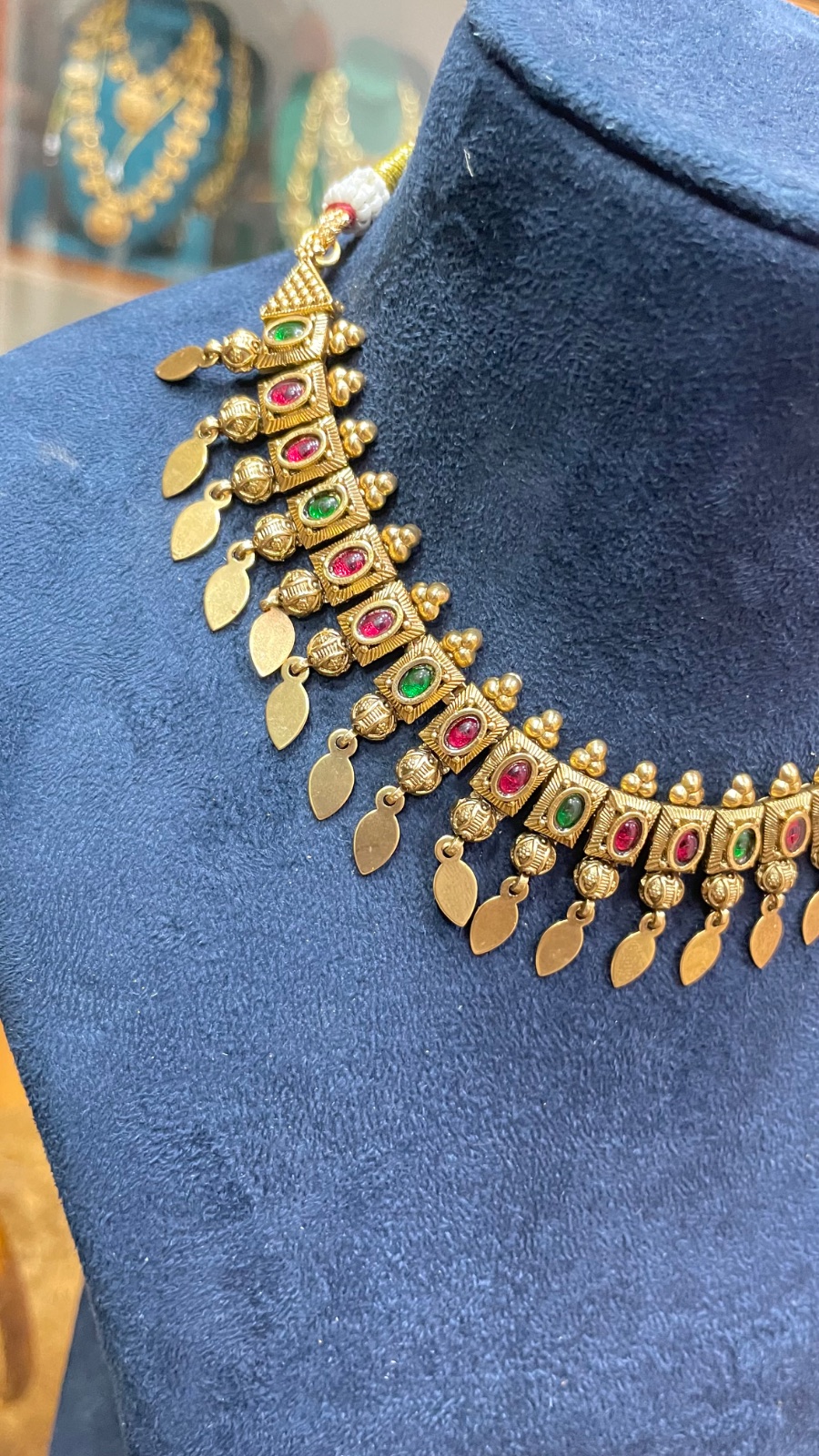 Green and red stones with leaf drops angle 2