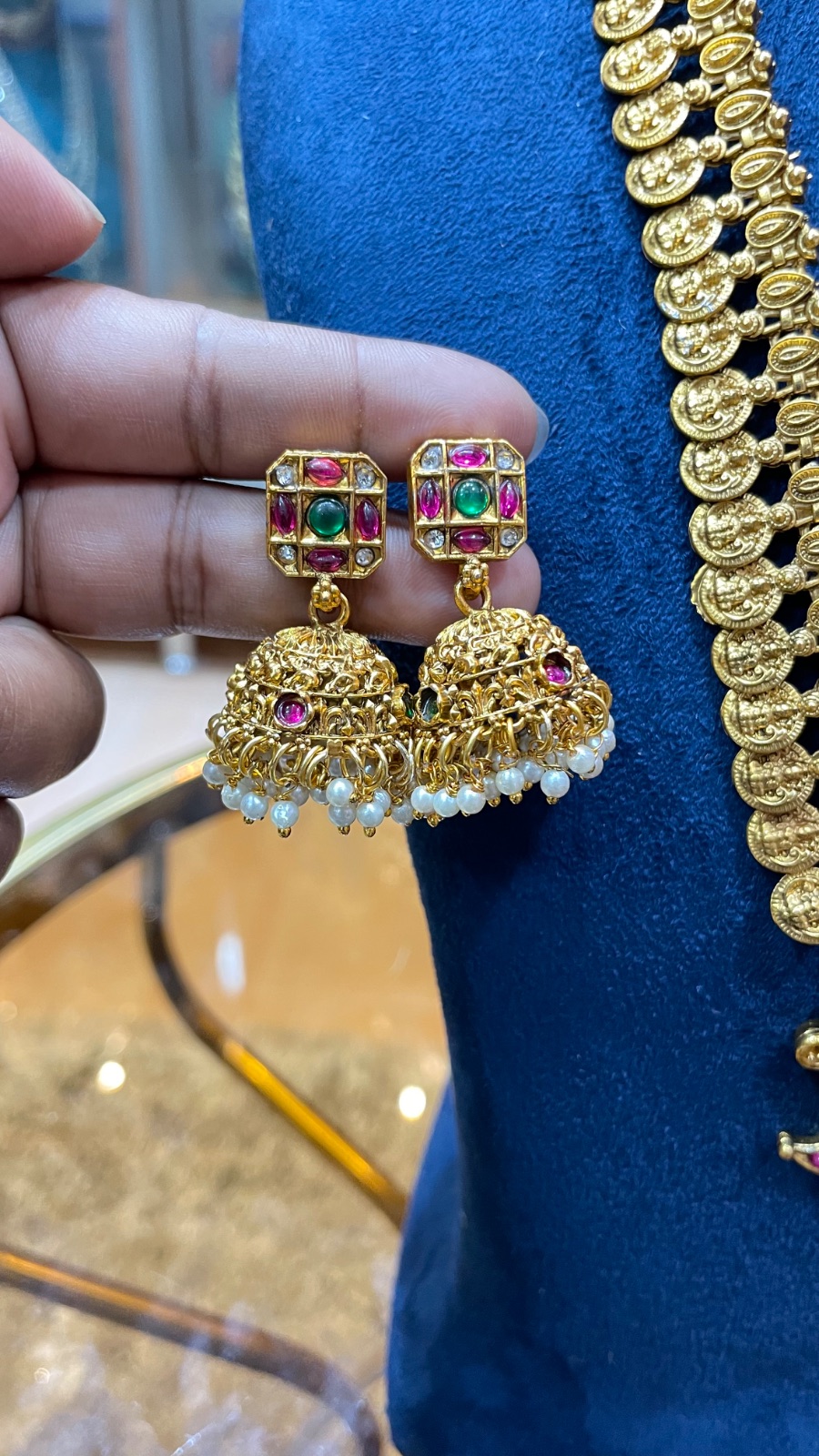 Puligoru design with peacock motifs pendant