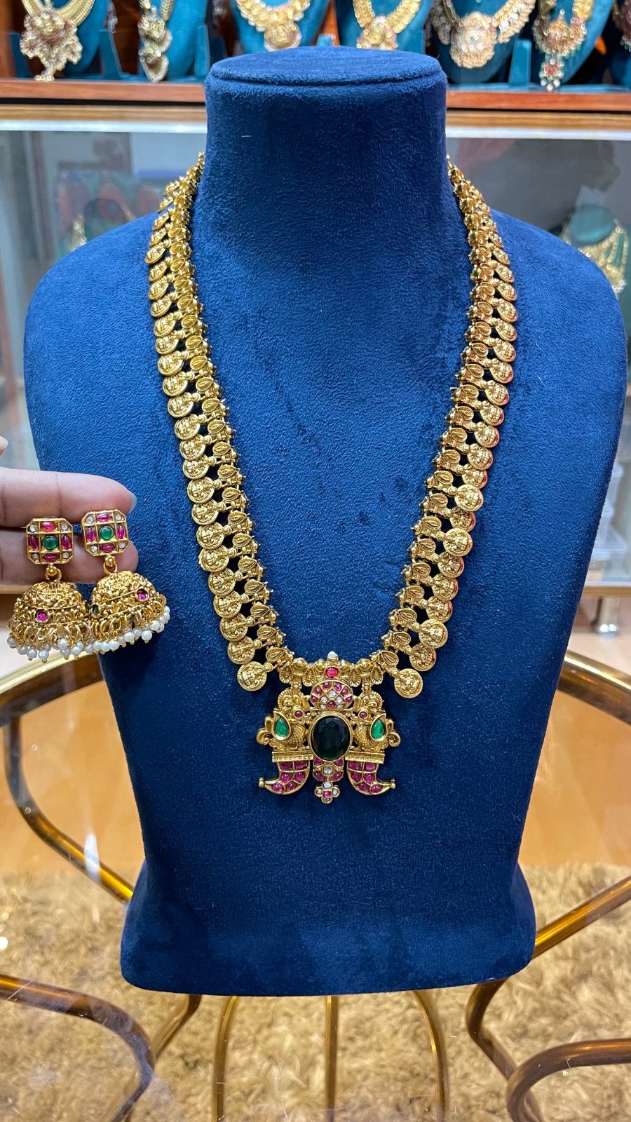 Puligoru design with peacock motifs pendant