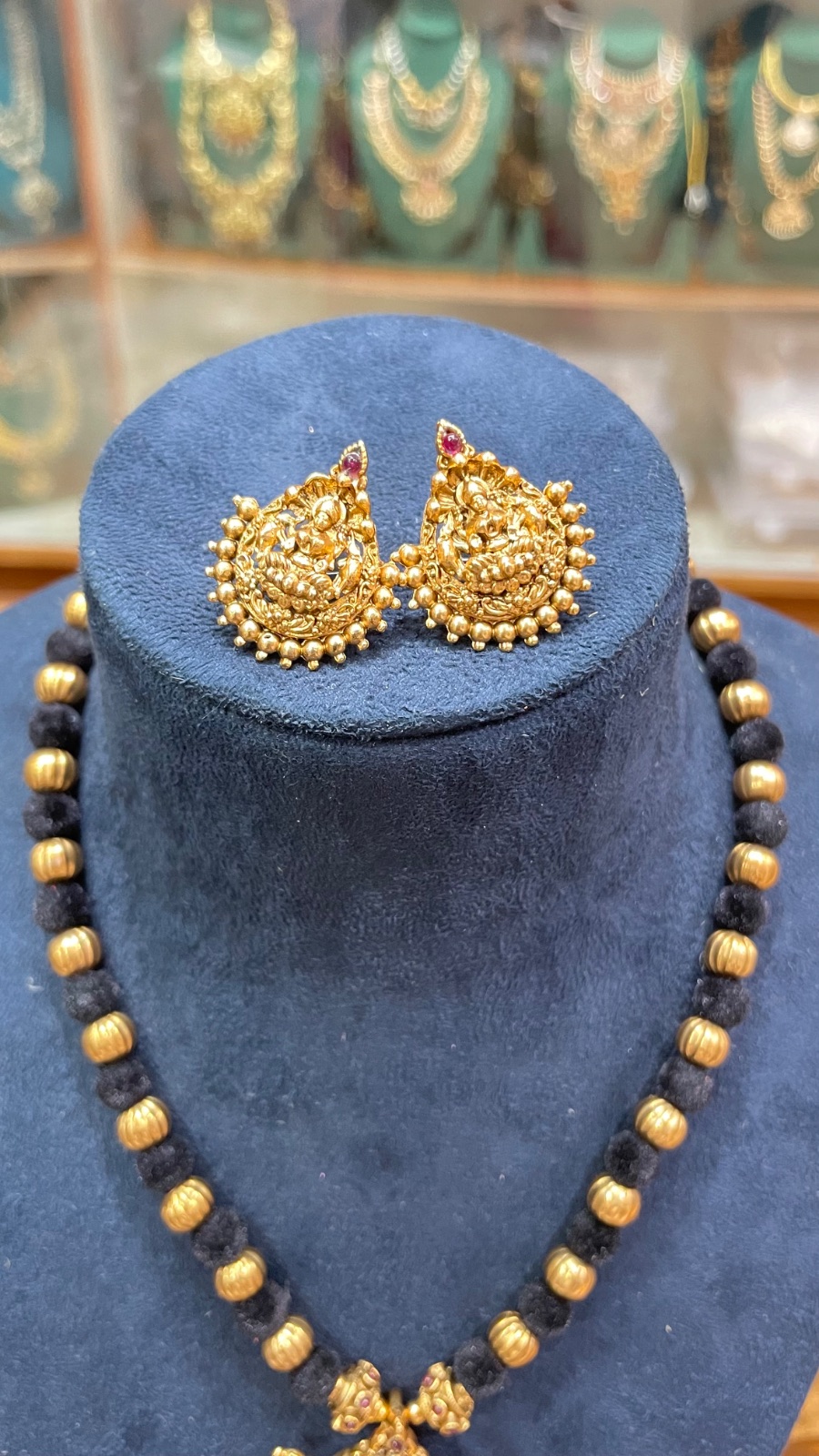 black tread with Lakshmi pendant
