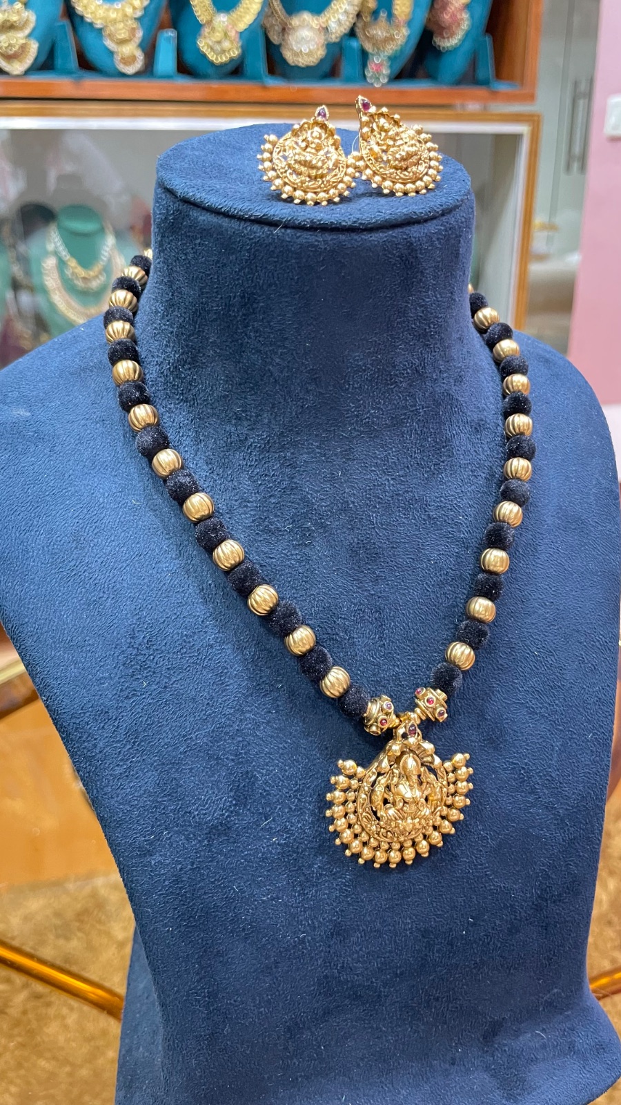 black tread with Lakshmi pendant angle 3