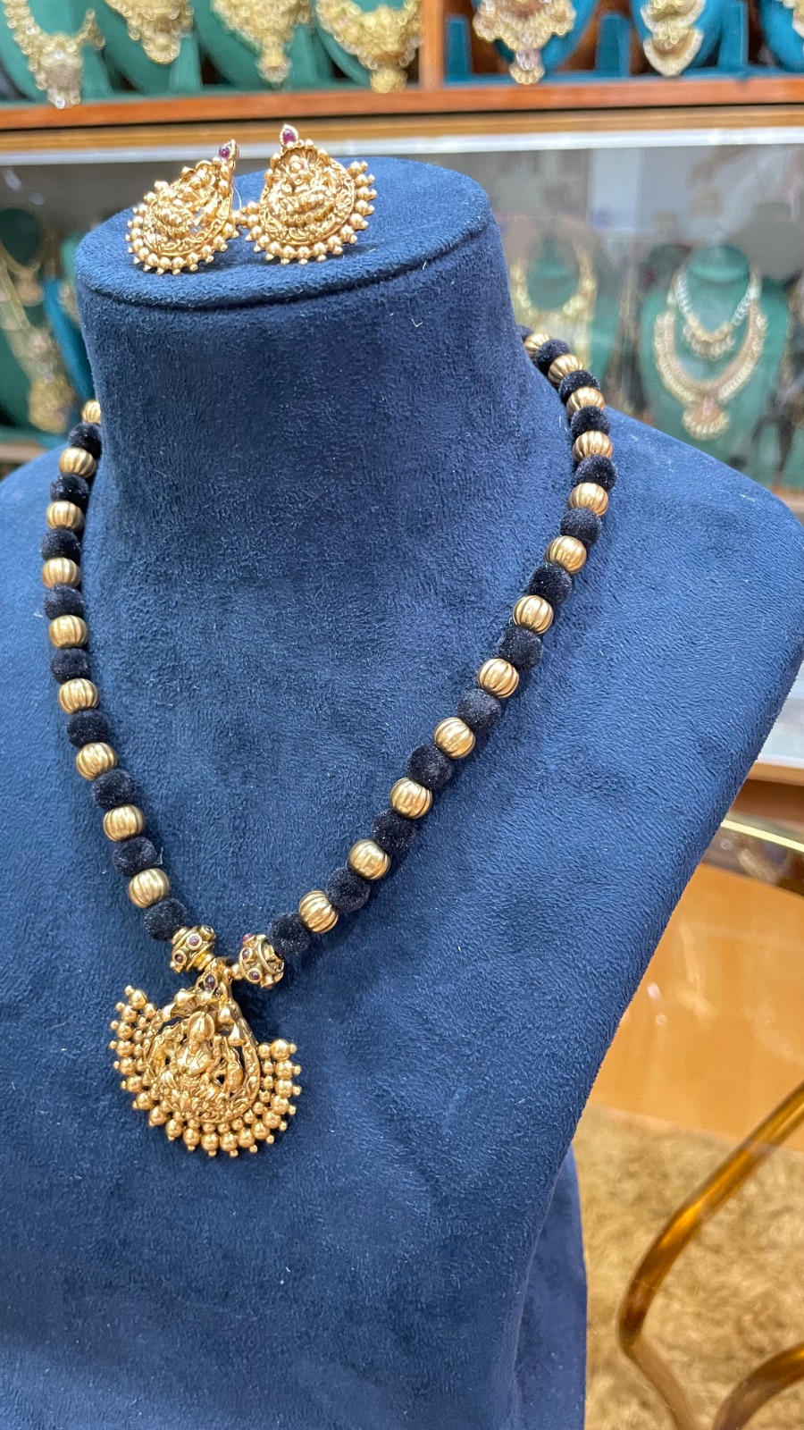 black tread with Lakshmi pendant angle 2