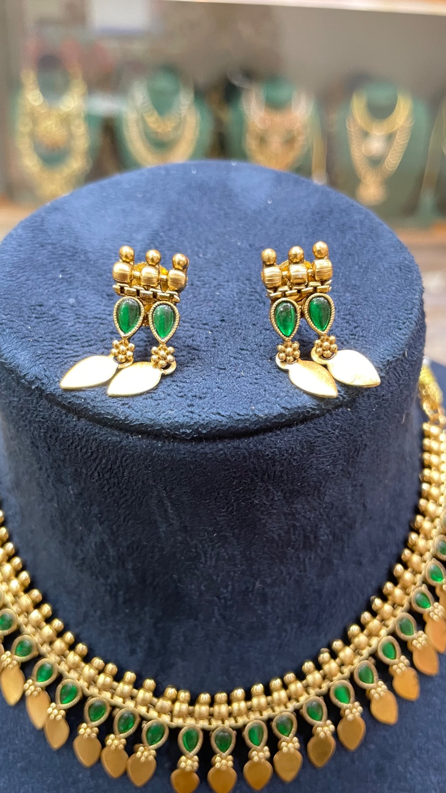 green stones with leaf dropping in Forest Green