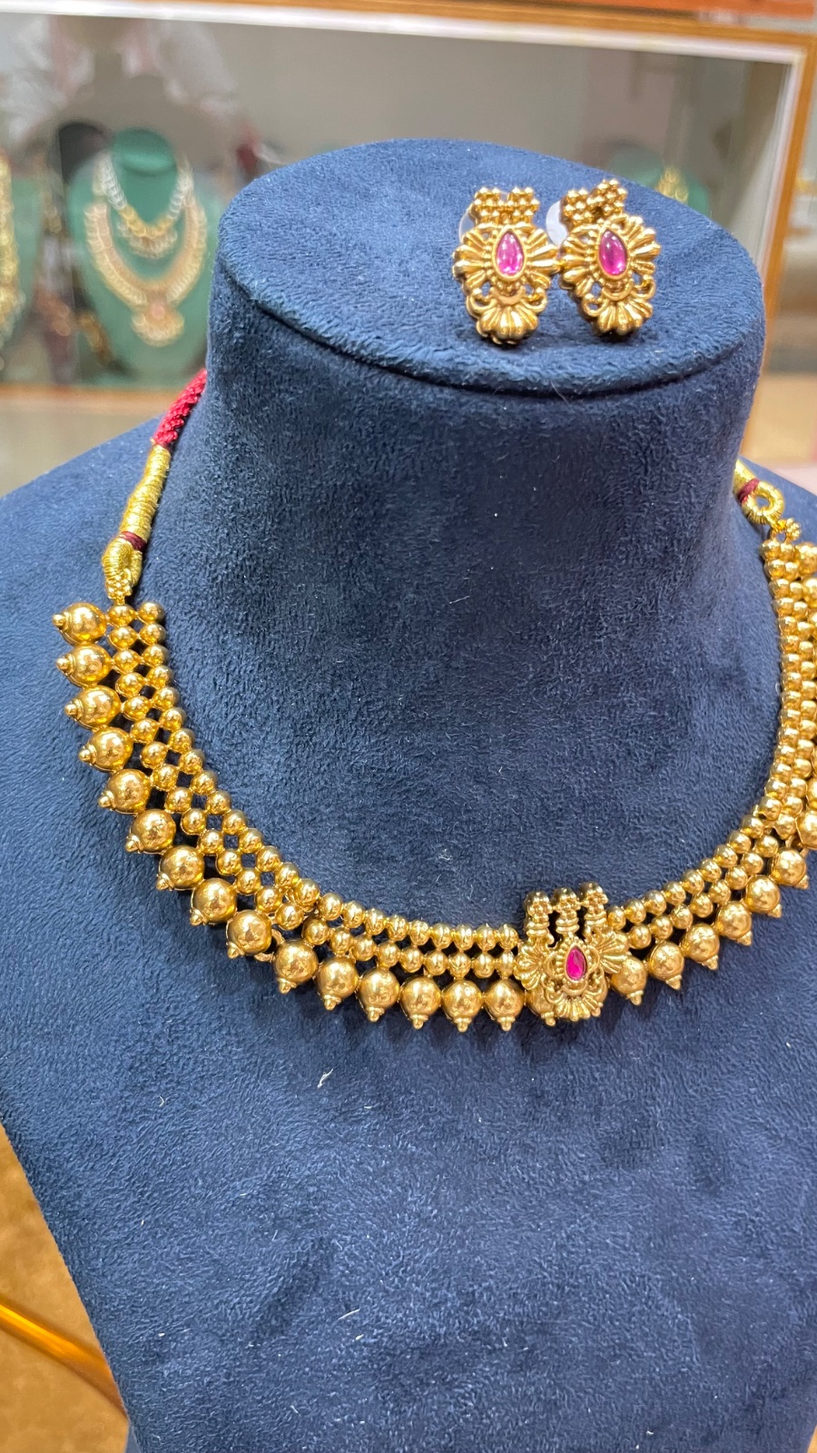 Golden Gundu design necklace angle 3