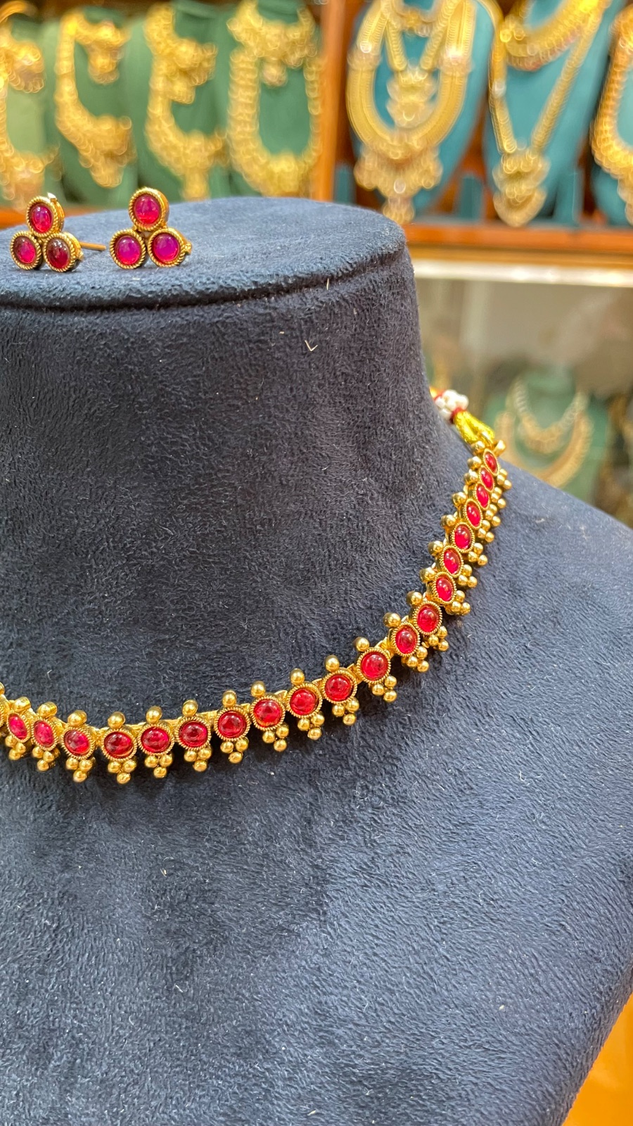 Reddish pink stone necklace angle 2