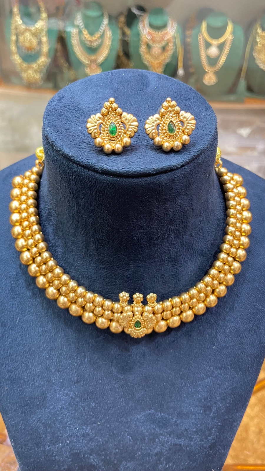 golden beads green stones