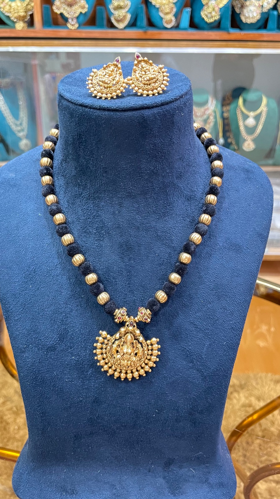 black tread with Lakshmi pendant angle 4