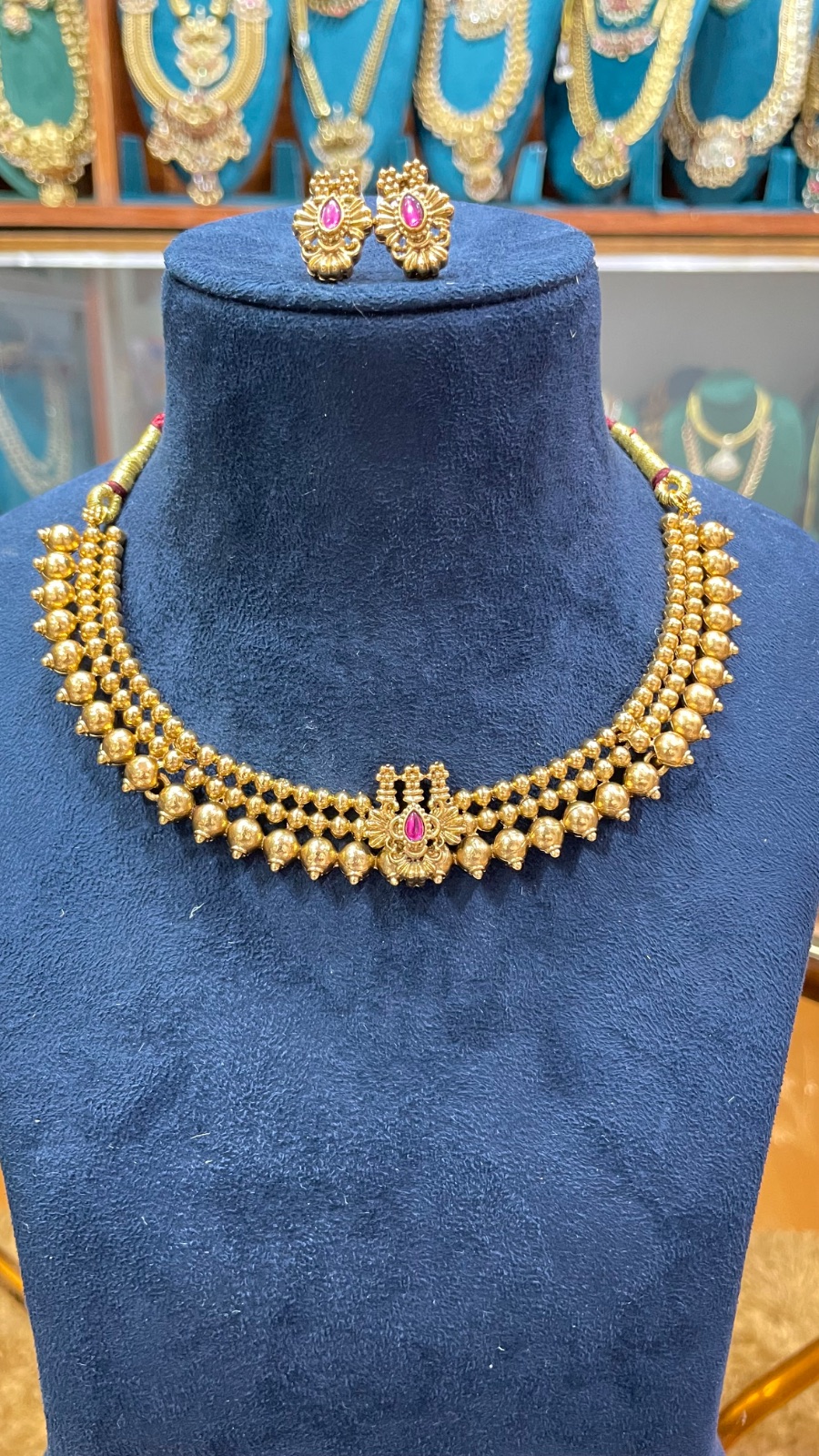Golden Gundu design necklace angle 4