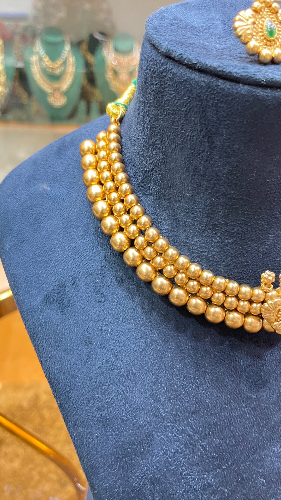 golden beads green stones angle 2